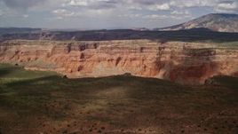 5.5K aerial stock footage of approaching wide canyon and distant mesa, Navajo Nation Reservation, Utah Aerial Stock Footage | AX132_016