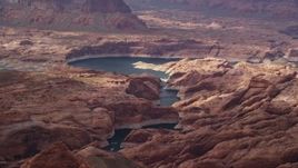 5.5K aerial stock footage of rock formations and Lake Powell, Navajo Nation Reservation, Utah Aerial Stock Footage | AX132_030