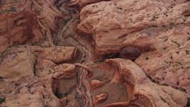 5.5K aerial stock footage of a bird's eye view of a stone bridge and dry riverbed, Rainbow Bridge National Monument, Utah Aerial Stock Footage | AX132_031