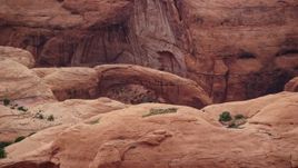 5.5K aerial stock footage of a view of a natural stone arch at Rainbow Bridge National Monument, Utah Aerial Stock Footage | AX132_047E