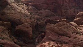 5.5K aerial stock footage of focusing on a stone arch, Rainbow Bridge National Monument, Utah Aerial Stock Footage | AX132_056E