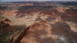 5.5K aerial stock footage tilt to bird's eye view of a small mesa, Navajo Nation Reservation, Arizona, Utah Aerial Stock Footage | AX132_081E