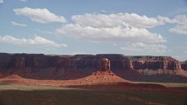 5.5K aerial stock footage approach tall butte, mesas in background, Navajo Nation Reservation, Arizona, Utah Aerial Stock Footage | AX132_100