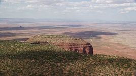 5.5K aerial stock footage of flying by desert mesa, revealing second mesa, Navajo Nation Reservation, Arizona, Utah Aerial Stock Footage | AX132_121E