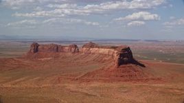 5.5K aerial stock footage of Train Rock mesa and desert valley, Navajo Nation Reservation, Arizona, Utah Aerial Stock Footage | AX132_126E