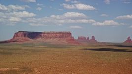 5.5K aerial stock footage of a wide view of Eagle Mesa and buttes, Monument Valley, Arizona, Utah Aerial Stock Footage | AX132_130E