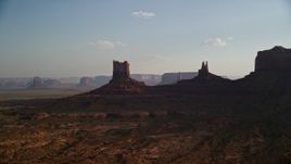 5.5K aerial stock footage of desert buttes in Monument Valley, Utah, Arizona, sunset Aerial Stock Footage | AX133_015E