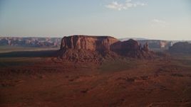 5.5K aerial stock footage of Spearhead Mesa in desert valley, Monument Valley, Utah, Arizona, twilight Aerial Stock Footage | AX133_030E
