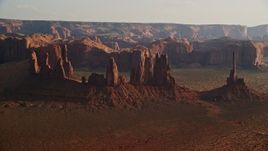 5.5K aerial stock footage of approaching buttes in Monument Valley, Utah, Arizona, twilight Aerial Stock Footage | AX133_037