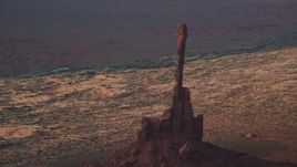 5.5K aerial stock footage of Totem Pole Butte in Monument Valley, Utah, Arizona, twilight Aerial Stock Footage | AX133_045