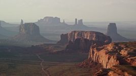 5.5K aerial stock footage of flying by Merrick Butte, Elephant Butte in Monument Valley, Utah, Arizona, twilight Aerial Stock Footage | AX133_063E