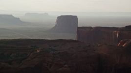 5.5K aerial stock footage of approaching Mitchell Butte in Monument Valley, Utah, Arizona, twilight Aerial Stock Footage | AX133_073E
