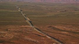 5.5K aerial stock footage of passing by Highway 163 in Monument Valley, Utah, Arizona, twilight Aerial Stock Footage | AX133_099
