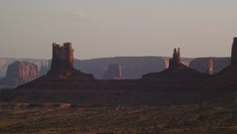 5.5K aerial stock footage of buttes on a hazy day, Monument Valley, Utah, Arizona, twilight Aerial Stock Footage | AX133_121E