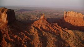 5.5K aerial stock footage bird's eye view of King on His Throne Butte, Monument Valley, Utah, Arizona, sunset Aerial Stock Footage | AX133_141E