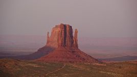 5.5K aerial stock footage flyby West Mitten Butte and East Mitten Butte, Monument Valley, Utah, Arizona, sunset Aerial Stock Footage | AX133_167E