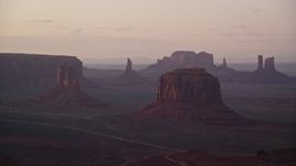 5.5K aerial stock footage of a view of West Mitten Butte, Merrick Butte, Monument Valley, Utah, Arizona, twilight Aerial Stock Footage | AX133_217E