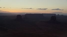 5.5K aerial stock footage of Merrick Butte, East Mitten Butte in Monument Valley, Utah, Arizona, twilight Aerial Stock Footage | AX134_053E
