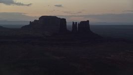 5.5K aerial stock footage of buttes in a layer of haze, Monument Valley, Utah, Arizona, twilight Aerial Stock Footage | AX134_059E