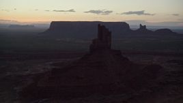 5.5K aerial stock footage of flying by Big Indian Butte in Monument Valley, Utah, Arizona, twilight Aerial Stock Footage | AX134_062E