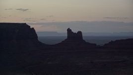 5.5K aerial stock footage of Setting Hen Butte in Monument Valley, Utah, Arizona, twilight Aerial Stock Footage | AX134_064