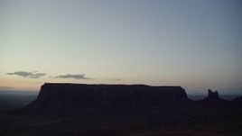 5.5K aerial stock footage of Eagle Mesa, Setting Hen Butte in Monument Valley, Utah, Arizona, twilight Aerial Stock Footage | AX134_065