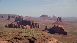 5.5K aerial stock footage wide view of buttes, seen from Spearhead Mesa in Monument Valley, Utah, Arizona Aerial Stock Footage | AX135_022E