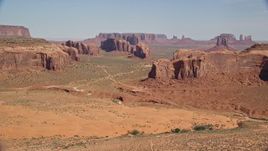 5.5K aerial stock footage approach buttes from Spearhead Mesa, Monument Valley, Utah, Arizona Aerial Stock Footage | AX135_026E