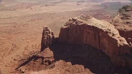 5.5K aerial stock footage tilt to a bird's eye view of rock formation in Monument Valley, Utah, Arizona Aerial Stock Footage | AX135_032E