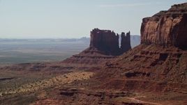 5.5K aerial stock footage of passing by desert buttes in Monument Valley, Utah, Arizona Aerial Stock Footage | AX135_063E