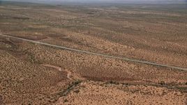 5.5K aerial stock footage of Highway 163 and Forrest Gump Point in Monument Valley, Utah, Arizona Aerial Stock Footage | AX135_073E