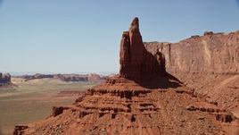 5.5K aerial stock footage of orbiting Rooster Rock and Meridian Butte, Monument Valley, Utah, Arizona Aerial Stock Footage | AX135_128E