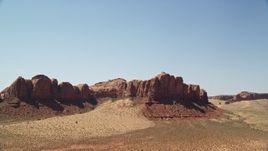 5.5K aerial stock footage of approaching a rugged desert butte, Monument Valley, Utah, Arizona Aerial Stock Footage | AX135_131E