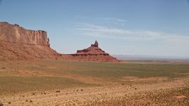 5.5K aerial stock footage descend and approach Rooster Rock, Monument Valley, Utah, Arizona Aerial Stock Footage | AX135_133