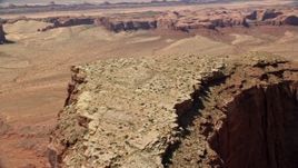 5.5K aerial stock footage of flying over Meridian Butte, pan across the top of the butte, Monument Valley, Utah, Arizona Aerial Stock Footage | AX135_153E