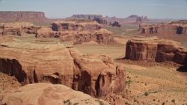 5.5K aerial stock footage of a wide view of numerous desert buttes and mesas, Monument Valley, Utah, Arizona Aerial Stock Footage | AX135_177E