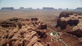 5.5K aerial stock footage of flying by Oljeto Mesa, revealing the Monument Valley Airport, Utah Aerial Stock Footage | AX135_202E