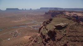 5.5K aerial stock footage of flying by Oljeto Mesa, revealing the Monument Valley Airport, Utah Aerial Stock Footage | AX135_203