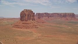 5.5K aerial stock footage of flying by Merrick Butte near West Mitten Butte, Monument Valley, Utah, Arizona Aerial Stock Footage | AX136_028E