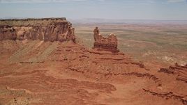 5.5K aerial stock footage of approaching and flying over Setting Hen Butte, Monument Valley, Utah, Arizona Aerial Stock Footage | AX136_043E