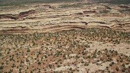 5.5K aerial stock footage of approaching canyon from mesa, pan to box canyon, Cedar Mesa, Utah Aerial Stock Footage | AX136_071E