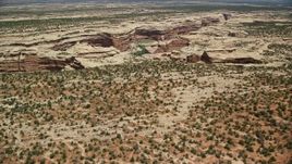 5.5K aerial stock footage of approaching Grand Gulch and pan across the deep canyon, Grand Gulch Primitive Area, Utah Aerial Stock Footage | AX136_082E