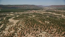 5.5K aerial stock footage of flying over and panning across shallow canyons, Natural Bridges National Monument, Utah Aerial Stock Footage | AX136_111E