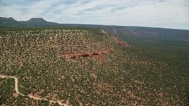 5.5K aerial stock footage of approaching a mesa from nearby mesa cliffs, Manti-La Sal National Forest, Utah Aerial Stock Footage | AX136_130E