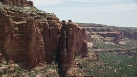 5.5K aerial stock footage of flying by boulders atop rock formations, Arch Canyon, Utah Aerial Stock Footage | AX136_153