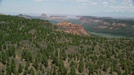 5.5K aerial stock footage of a mesa with trees, approaching a butte, Manti-La Sal National Forest, Utah Aerial Stock Footage | AX136_184E