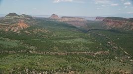 5.5K aerial stock footage of a canyon, approach buttes and mesas, Manti-La Sal National Forest, Utah Aerial Stock Footage | AX136_188E