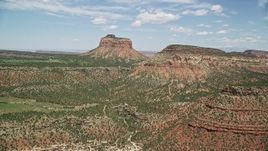5.5K aerial stock footage of flying between Cathedral Butte and a mesa, Manti-La Sal National Forest, Utah Aerial Stock Footage | AX136_195E