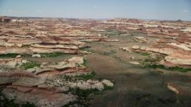 5.5K aerial stock footage of a narrow valley and rock formations, Canyonlands National Park, Utah Aerial Stock Footage | AX136_205E