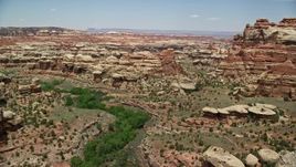 5.5K aerial stock footage of flying over boulders, rock formations and canyons, Canyonlands National Park, Utah Aerial Stock Footage | AX136_211E